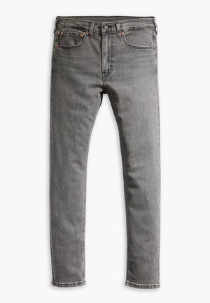 Gray denim jeans with a slim fit, featuring front pockets, a coin pocket, and contrast stitching. The fabric has a slightly faded texture.