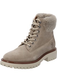 Botín de ante beige con cuello de pelo sintético, suela de goma de contraste, puntera redonda y ojales de metal. Cierre de cordones y detalle de marca en el lateral.