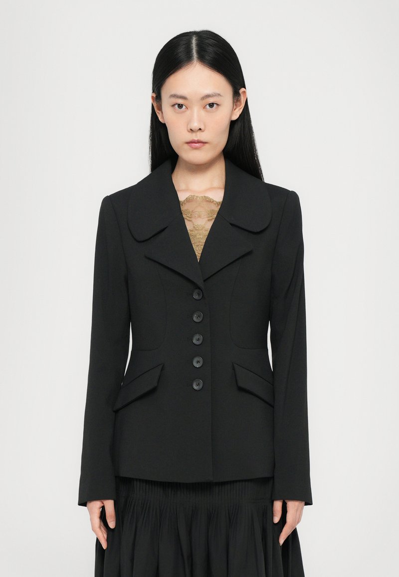 Black blazer with a notched collar, front pockets, and six buttons. Smooth fabric; structured design; fitted silhouette.