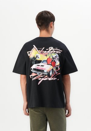 Black cotton t-shirt featuring a colorful graphic of a pink muscle car, palm trees, and skulls on the back. Short sleeves and relaxed fit.