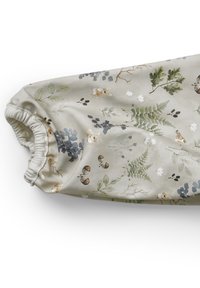 Ljust beige tyg med blommor och djurmönster. Har kaniner, ormbunkar och blad i gröna och blå nyanser. Samlad elastisk manschettdesign.
