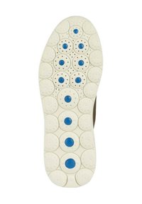 Witte schoenzool met cirkelvormige patronen en symmetrisch geplaatste blauwe stippen langs het midden voor grip en ontwerp.