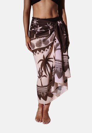 Jupe portefeuille arborant un motif floral et palmiers marron et rose clair, réalisée en tissu léger avec une taille nouée.