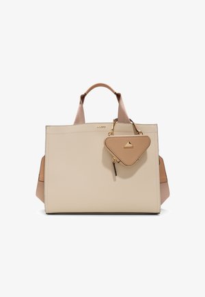 Beige faux leather tote bag with smooth texture, geometric design, dual top handles, and a detachable triangle-shaped charm. Gold hardware accents.