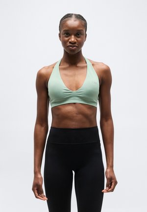 DEFINE SEAMLESS HALTER SPORTS BRA - Urheiluliivit: kevyt tuki - light moss green