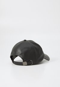 Black leather cap with a curved visor, adjustable strap at the back, and stitched detailing on the crown. Smooth texture and sleek design.