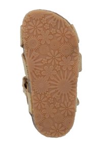 Suela de sandalia marrón claro con patrón floral, que cuenta con goma texturizada para mayor agarre. El diseño incluye correas ajustables para un ajuste y comodidad óptimos.