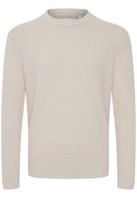 Pull beige tricoté avec un motif texturé, encolure ronde, poignets et ourlet côtelés. Fabriqué en tissu doux et confortable.