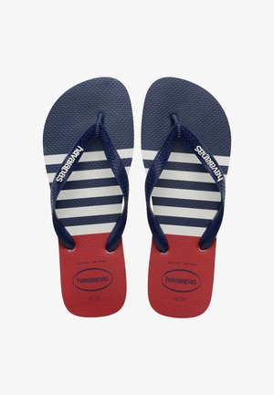 Pár námornícky modrých, bielych a červených pásikavých žabiek s textúrovanými remienkami s označením "havaianas" na bielom pozadí.