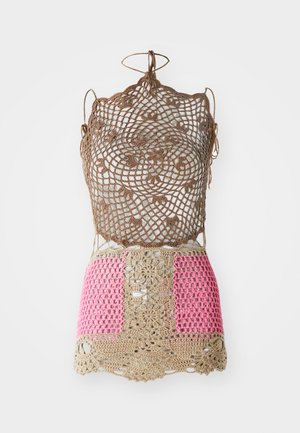 Crochet top with intricate brown pattern, featuring pink and beige sections. Adjustable ties at the shoulders and hem. Open weave texture.