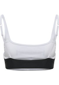 Svart och vit bralette i slät tyg, med justerbara band, en svart rem vid botten och en halv genomskinlig överdel.