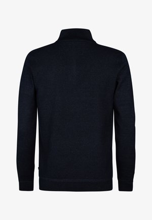 Mørkeblå strikket sweater med halvlange lynlås, lange ærmer og tekstureret stof. Ribstrikkede manchetter og kantdetalje for pasform og struktur.