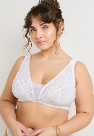 Bralette bianco in pizzo con design a V, motivo floreale e spalline larghe. Presenta una fodera liscia sotto, offrendo comfort e supporto.
