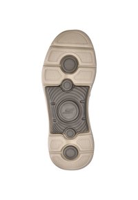 Schoenzool in een beige kleur met gestructureerde grippatronen, ronde accenten en een centraal logo-element. De materialen lijken van rubber.