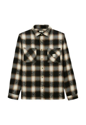 Chemise à carreaux noire, blanche et beige, à manches longues et deux poches poitrine, dont une avec un petit patch logo carré.
