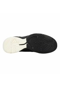 Sportschuhsohle mit einer schwarzen Gummistruktur, die Zickzackmuster aufweist und einen beigen Akzent an der Ferse hat, entworfen für Traktion und Stabilität.