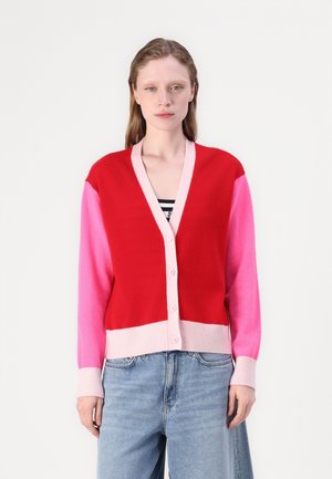 Red and pink color-blocked cardigan with a v-neck, long sleeves, and a button front. Made of soft knit fabric with ribbed cuffs.