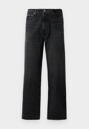 Vaqueros negros con corte recto, fabricados en denim. Cuentan con cierre de botón y cremallera, herrajes de cobre y dobladillo ligeramente deshilachado en la parte inferior.
