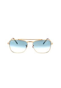 Occhiali da sole Ray-Ban con montatura in metallo dorato, lenti di forma quadrata e gradiente blu. Presentano un design a doppio ponte e stanghette sottili.