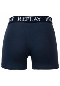 Marineblauwe katoenen boxershorts met een elastische tailleband voorzien van het "REPLAY" logo in het wit. Glad textuur en een aansluitend ontwerp met platte naden.