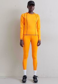 7 DAYS Active TECH  - Legging (type pantalon) - vibrant orange