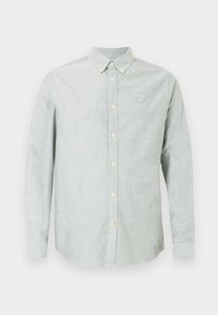 Camisa de botão de manga longa cinza-claro com colarinho com botões e pequeno logótipo bordado no lado esquerdo do peito.