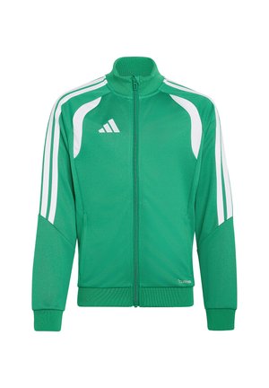 Chaqueta deportiva verde y blanca con cremallera, cuello alto, logo blanco de Adidas en el pecho y rayas blancas a lo largo de las mangas.