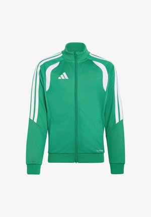 Chaqueta deportiva verde y blanca con cremallera, cuello alto, logo blanco de Adidas en el pecho y rayas blancas a lo largo de las mangas.