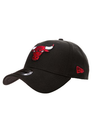 Black baseball cap made of fabric with an embroidered red bull logo on the front and a smaller red accent on the side. Curved brim design.