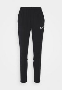Schwarze Nike Sporthosen mit elastischem Bund, schmal zulaufendem Bein und einem weißen Logo in Hüfthöhe. Glatter, leichter Stoff.