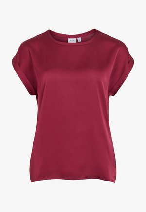 Blouse femme à manches courtes de couleur rouge profond avec un col rond et des poignets de manches repliés, fabriquée en tissu lisse.