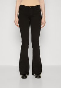 Black flared jeans with a fitted waist, front pockets, and a smooth denim texture. Features a classic button closure and contrast stitching.