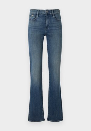 Sötét kék, harAngos farmernadrág, magas derékkal, egy elülső gombbal, és enyhe kopással a lábak mentén.