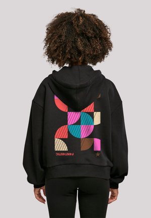 Black hoodie featuring a colorful geometric pattern on the back in shades of red, pink, blue, and brown; made from soft fabric.