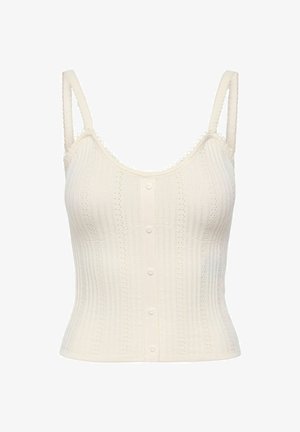 Caraco en maille couleur crème avec fines bretelles, boutons en forme de cœur sur le devant et délicate bordure en dentelle le long des bords.