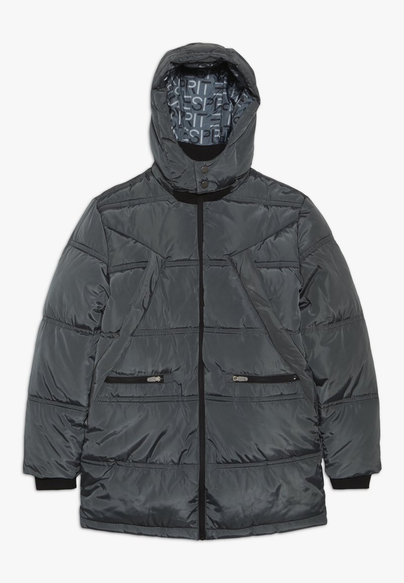 Szary kurtka puchowa z zapięciem na zamek, dwiema kieszeniami na zamek, kapturem i ściągaczami na mankietach. Wnętrze ma wzorzystą podszewkę.