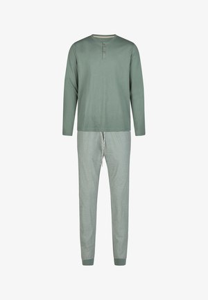Grünes Baumwolloberteil mit langen Ärmeln, entspannter Passform und geknöpften Ärmeln, kombiniert mit weichen, hellgrünen, gestreiften Jogginghosen mit elastischem Bund.