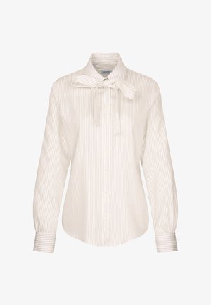 Biała bluzka w paski z wiązanym kołnierzykiem, zapinana na guziki z długimi rękawami i mankietami z wąskimi paskami. Wykonana z gładkiego materiału.