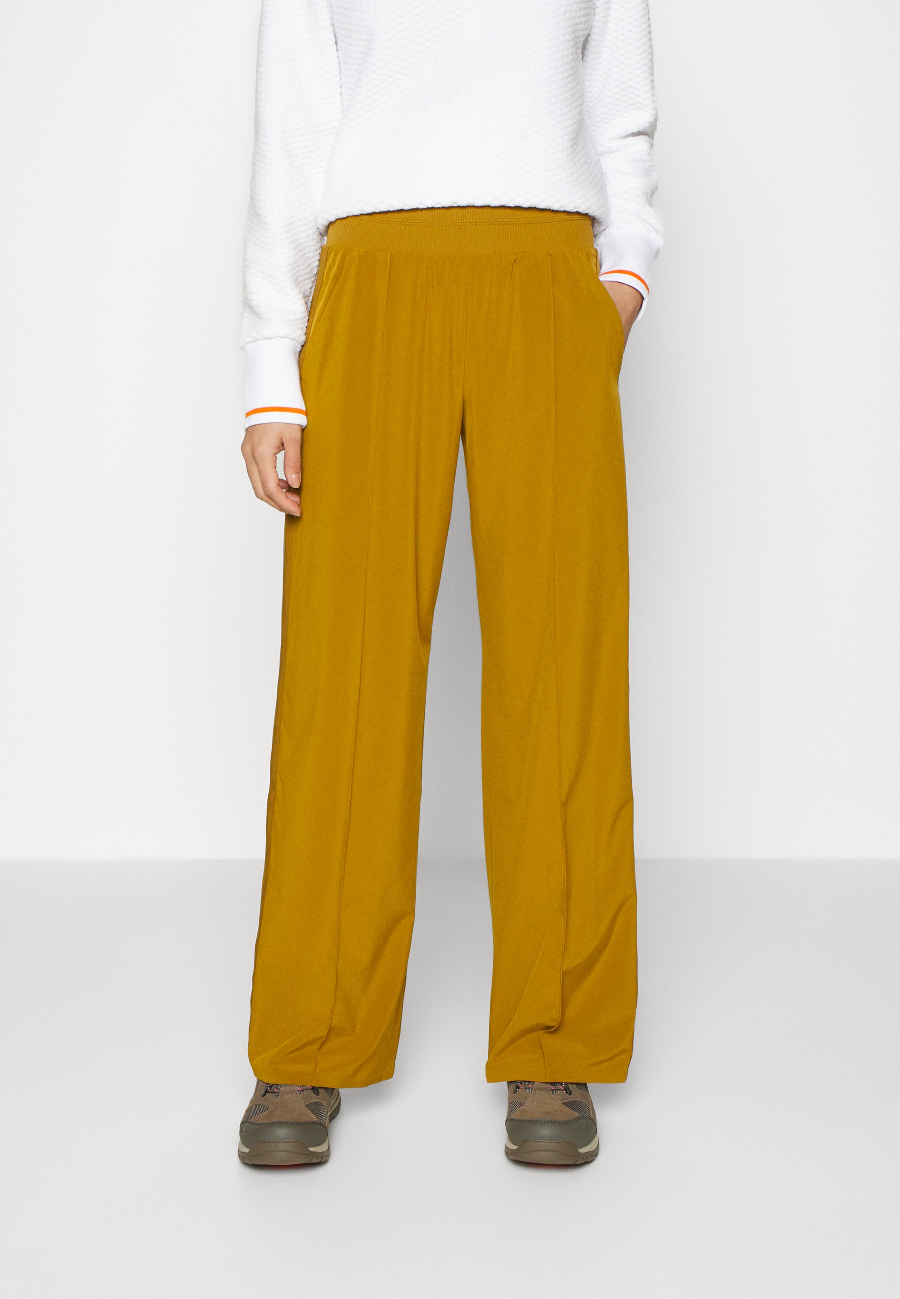 Athleta NOLITA WIDE LEG - Pantalones deportivos - brass yellow/amarillo -  Zalando.es