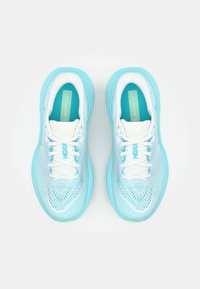Light blue running shoes with a mesh upper, white laces, and a cushioned sole. Features HOKA branding on the side and tongue.