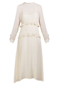 Kremlový dlouhý rukáv šaty s černými puntíky, s volánkovým pasem a manžetami, vyrobené z lehkého materiálu s volným siluetou.