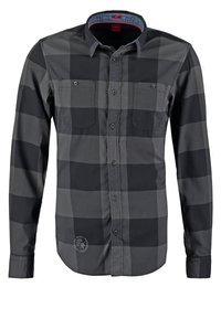 Schwarz-grau kariertes Langarmhemd mit zwei Brusttaschen, Knopfleiste und Denim-Applikation am Kragen. Aus Baumwolle gefertigt.