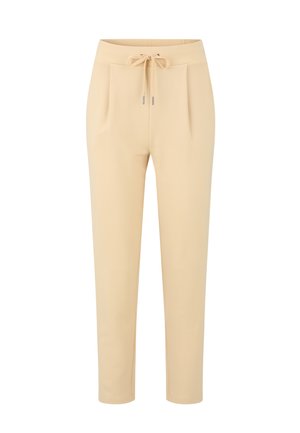 Lichtbeige broek met een elastische tailleband, plooien aan de voorkant en taps toelopende pijpen. Gemaakt van een zachte stof met een gladde textuur.