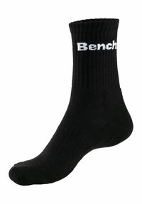Schwarze Baumwollcrew-Socke mit geripptem Design. Verfügt über das weiße "Bench"-Logo, das in die Seite eingestrickt ist. Knöchelhohes Design mit verstärktem Fersenbereich.