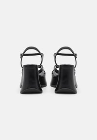Call it Spring GROOVYY - Sandali z visoko peto - black