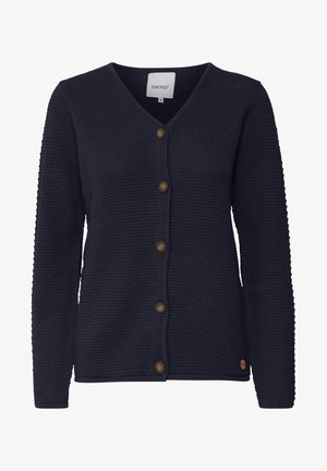 Navy knitted cardigan with a v-neck, button front, and textured pattern. Features brown buttons and a small logo detail on the hem.