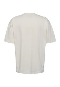Korte mouwen, ronde hals t-shirt in off-white katoen. Zachte textuur, losse pasvorm en minimalistisch ontwerp zonder zichtbare patronen of details.