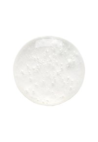 Gel trasparente e circolare con bolle visibili e una texture liscia. Superficie riflettente, principalmente bianca con una leggera iridescenza.