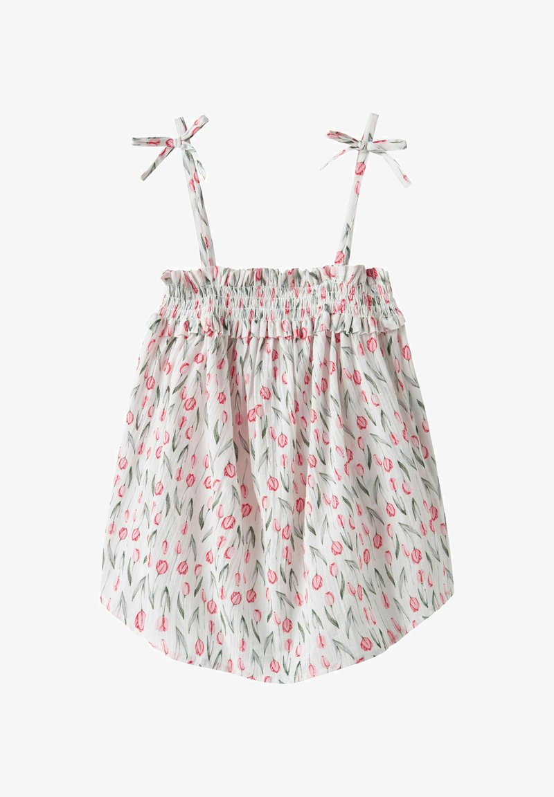 Květinový top bez rukávů se smockovanou korzetovou částí, zdobený růžovými tulipány na bílém pozadí, s nastavitelnými šňůrkami na ramenou a uvolněným, volným střihem.