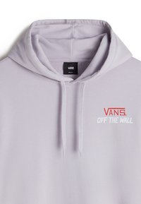 Light lavender hoodie made of soft fabric featuring a kangaroo pocket, drawstring hood, and "VANS OFF THE WALL" logo in red and white.